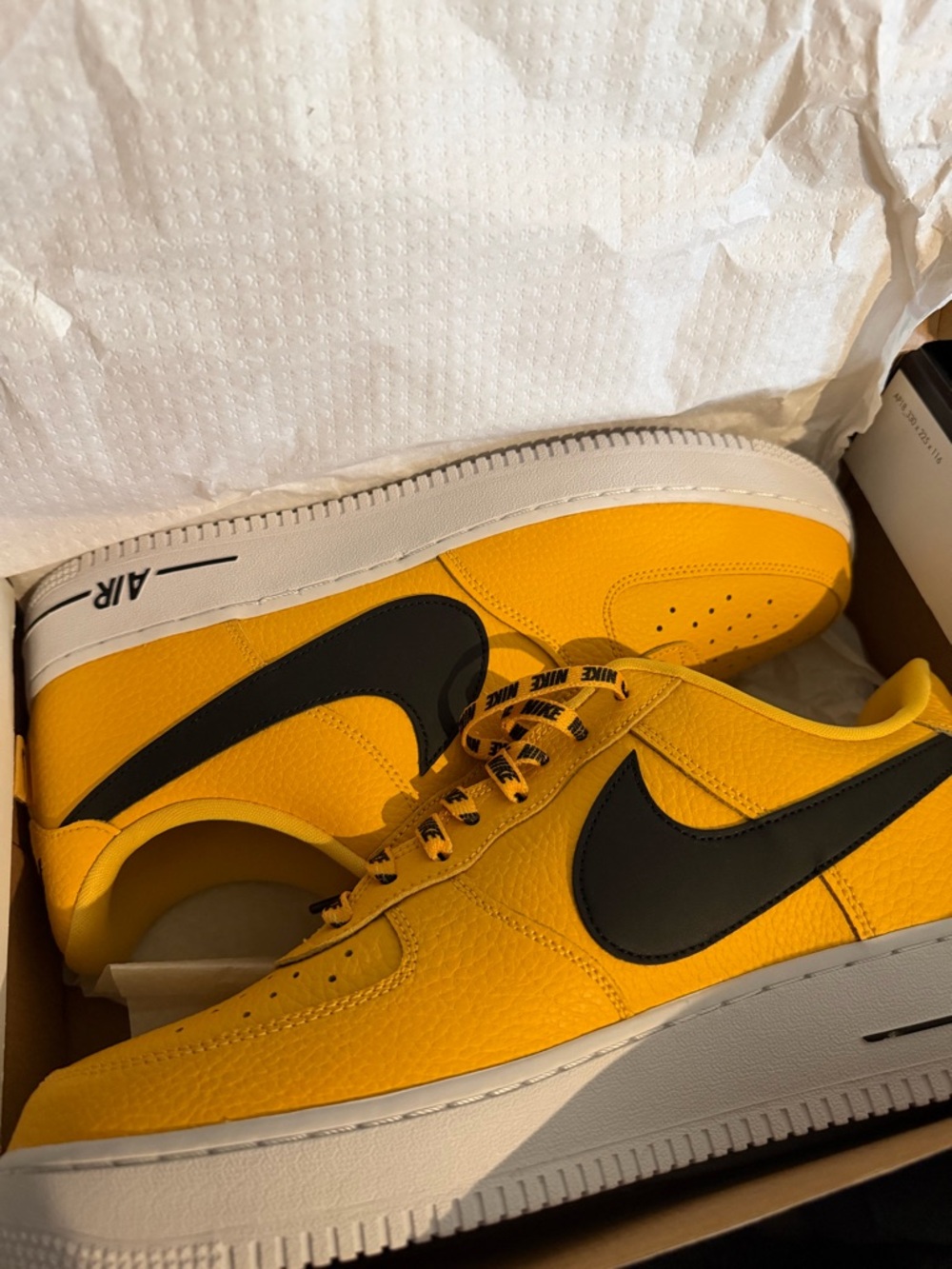 Nike Yellow Low-Top Sneakers with Black Swoosh